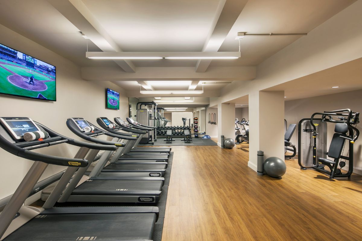 a room with treadmills and exercise equipment