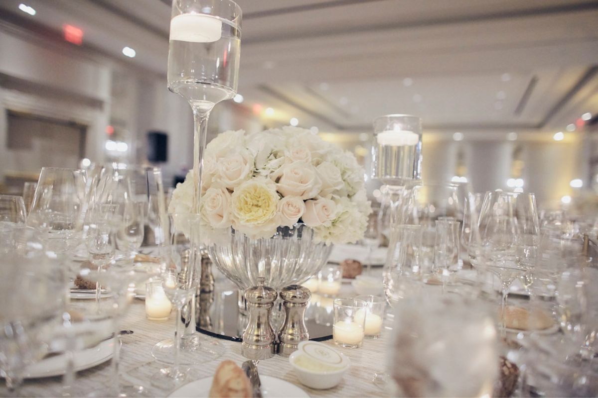 a table set with candles and flowers