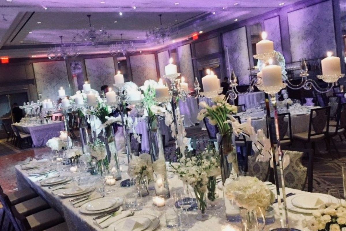 a table with candles and flowers