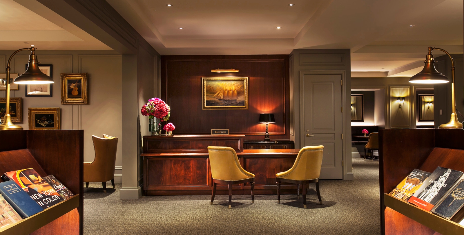 a room with a desk and chairs