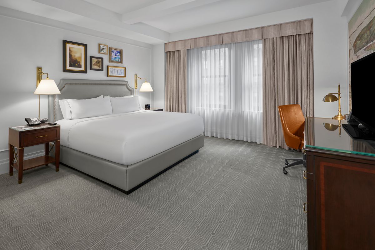 a room with a bed and a desk