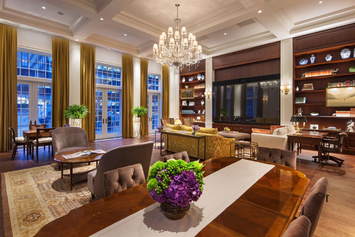 a room with a chandelier and chairs