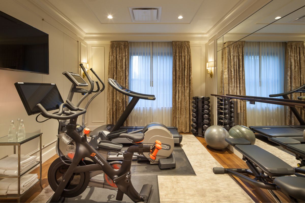 a room with exercise equipment and a mirror