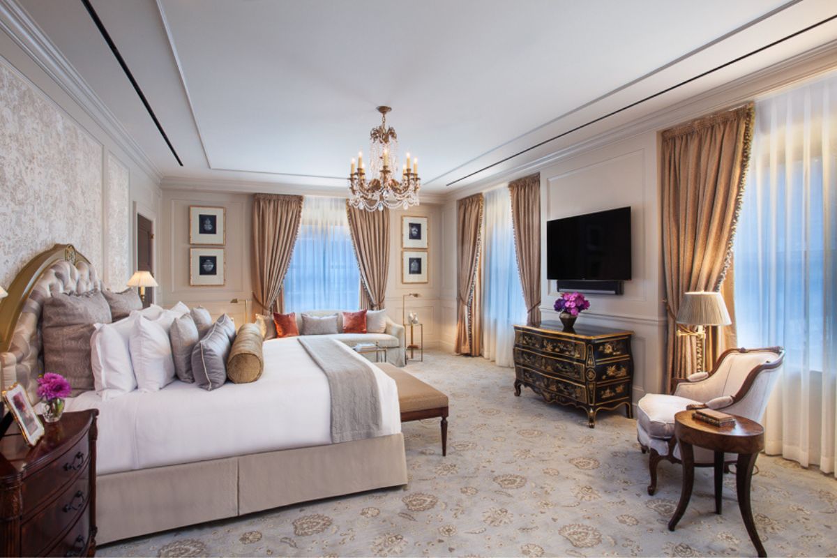 a bedroom with a bed and a television