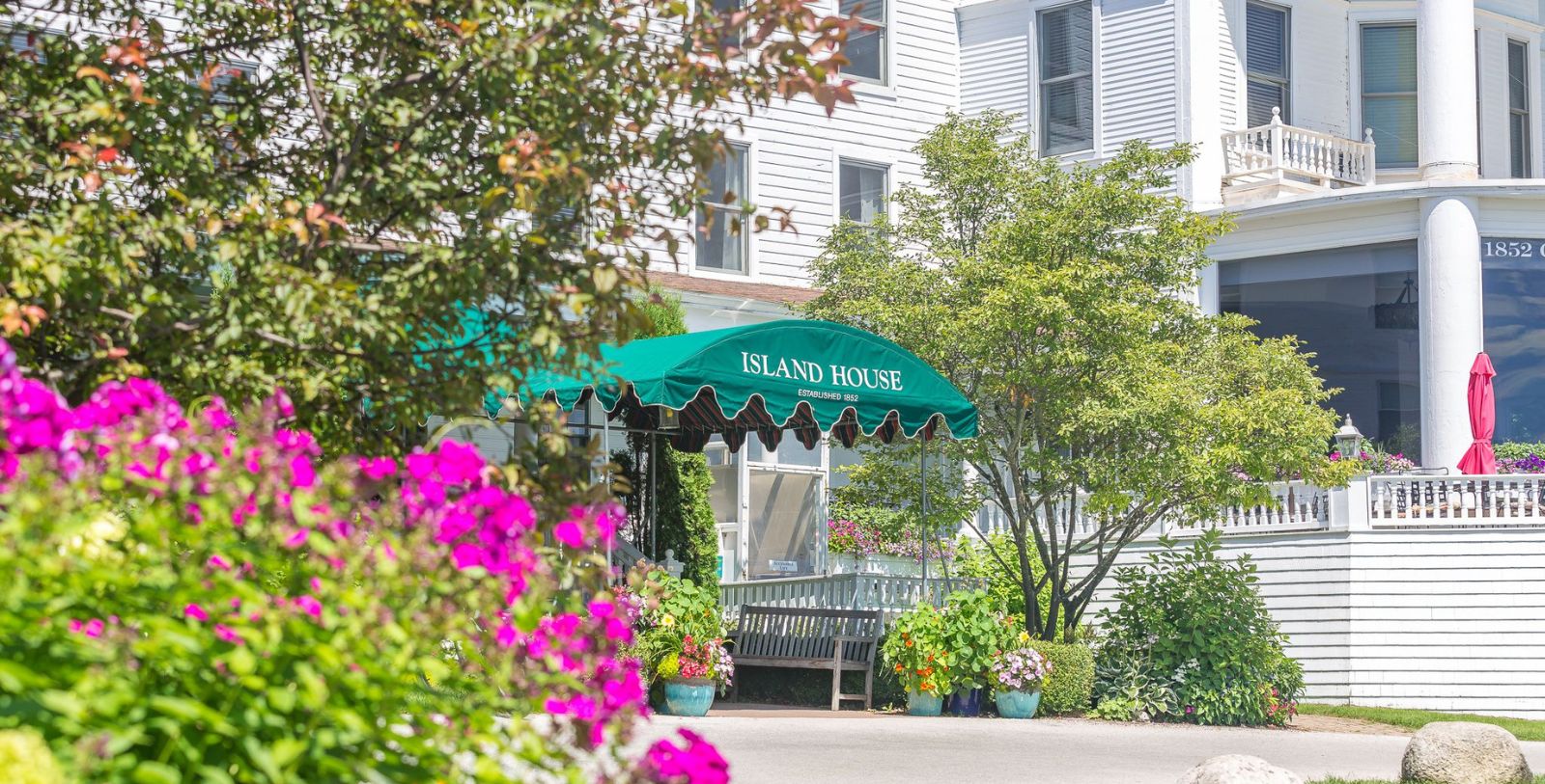 a green awning in front of a building