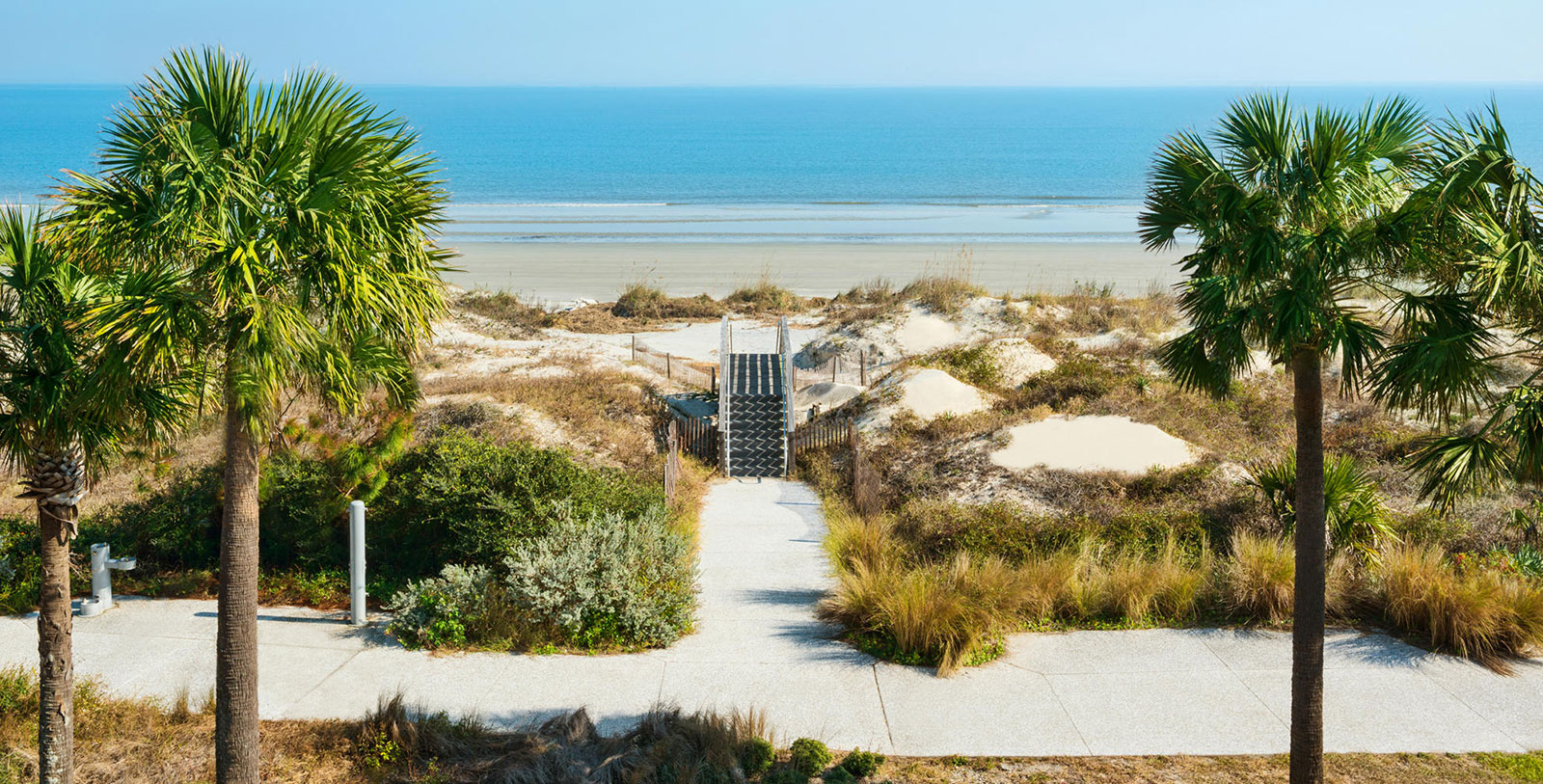 a walkway leading to a beach