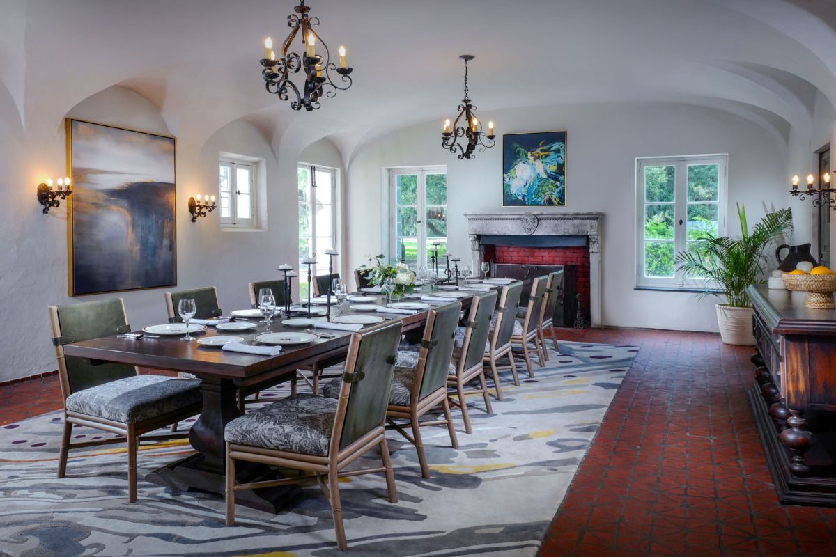 a large dining room with a large table and chairs