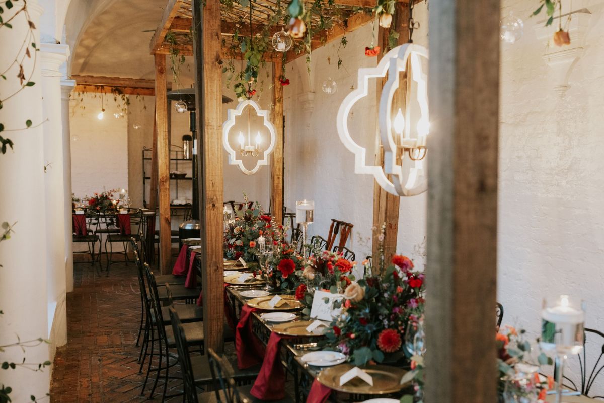 a long table with flowers and candles