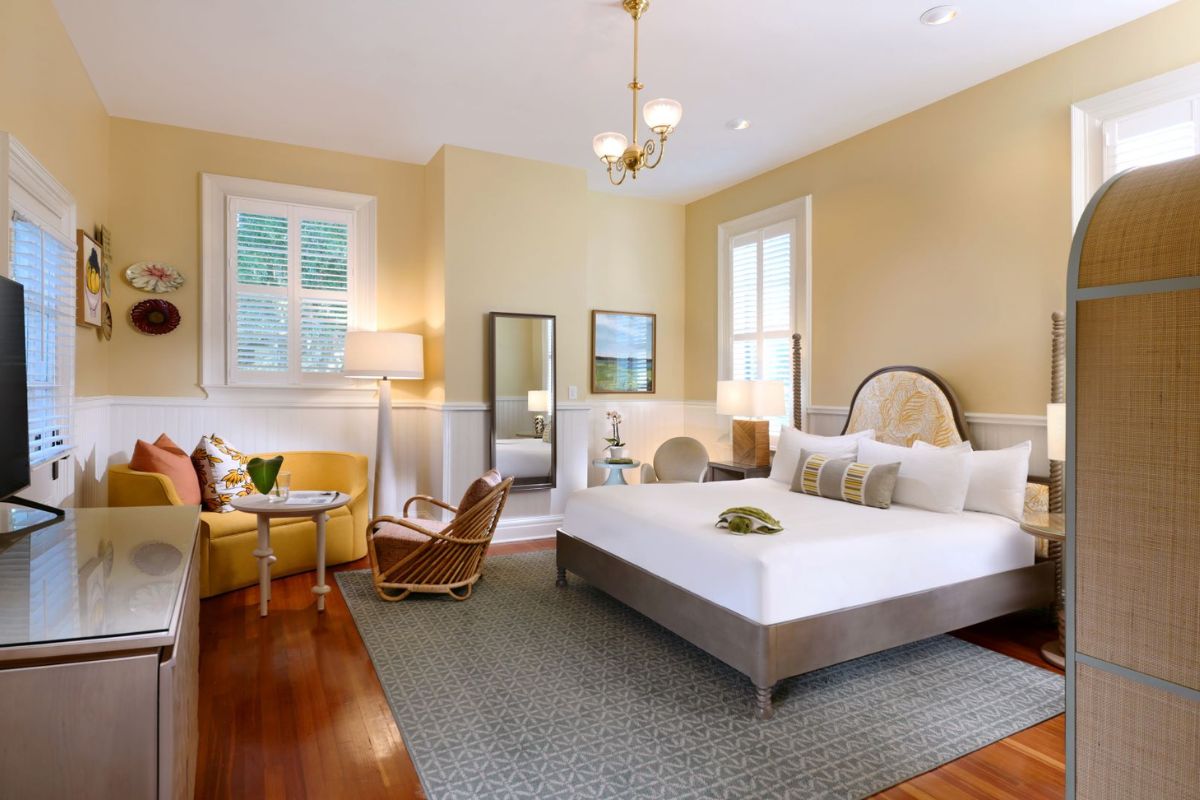 a bedroom with a bed and a chair