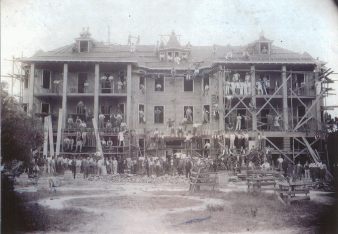 a group of people on scaffolding outside a building