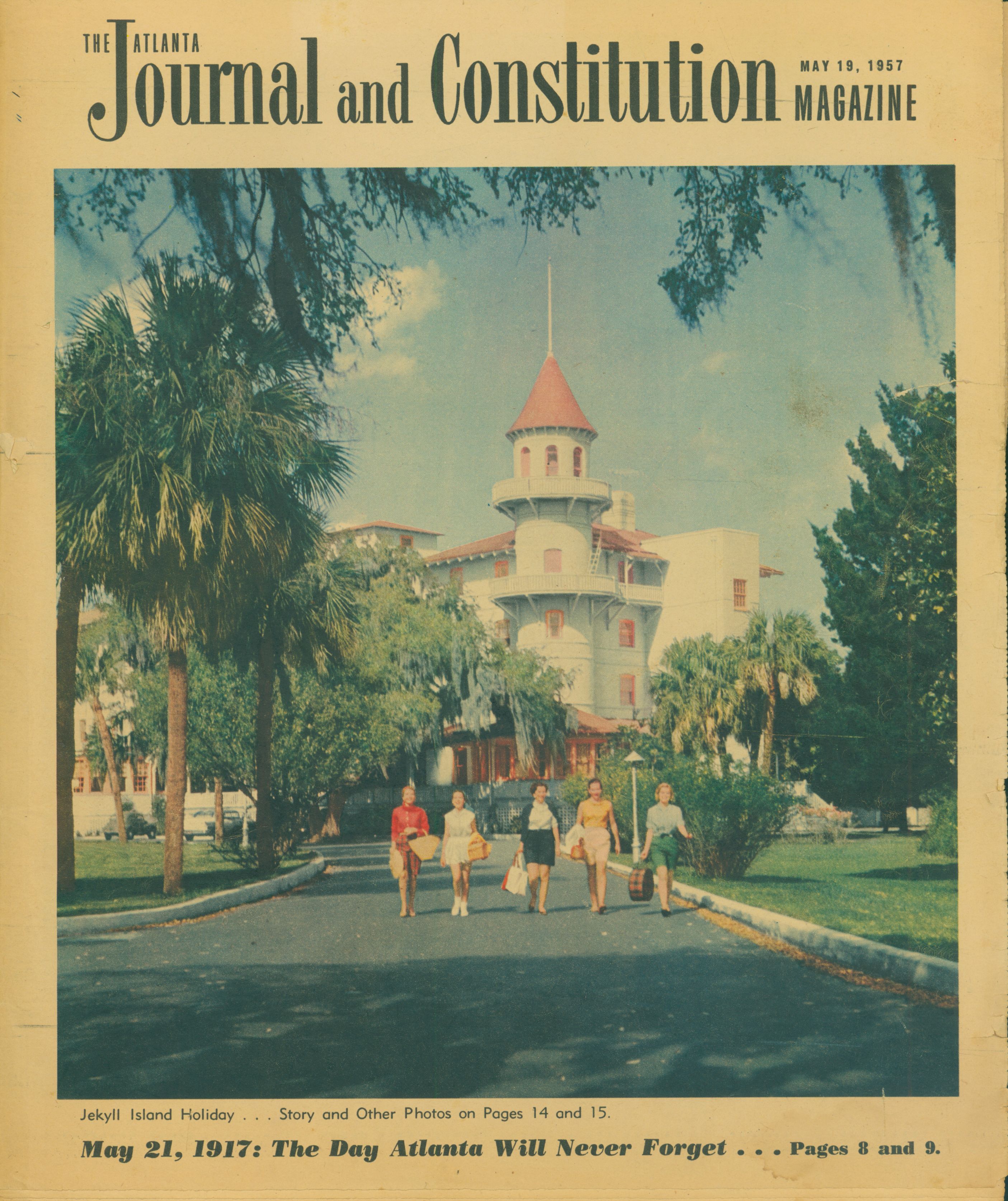 a magazine cover with a group of people walking on a road