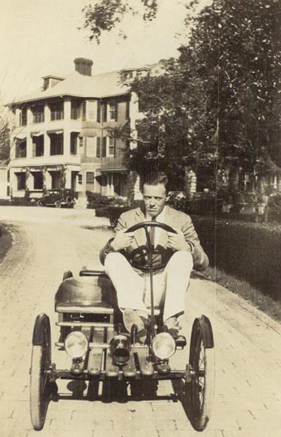 a man driving a small vehicle