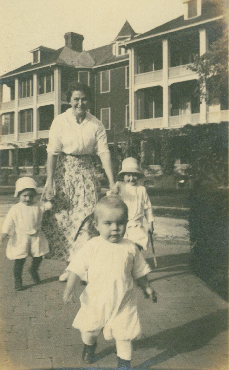 a woman walking with children