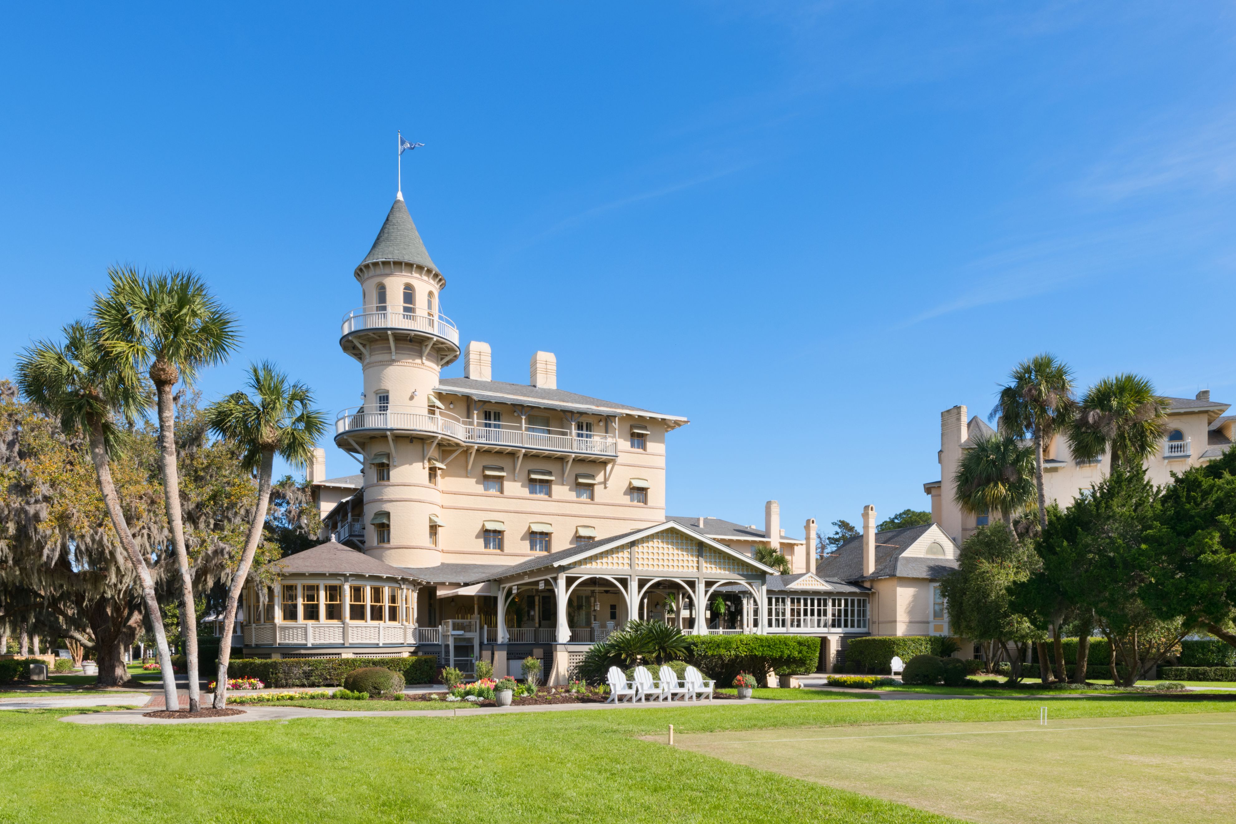 a large building with Jekyll Island and a lawn