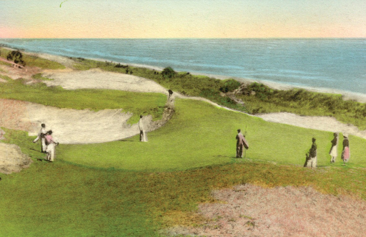 a man holding a golf club