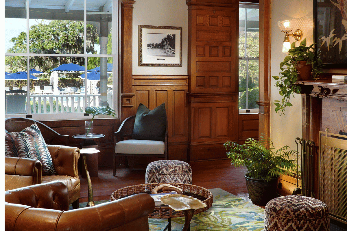 a room with a couch and chairs