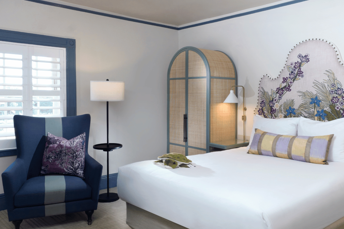 a room with a bed and a lamp