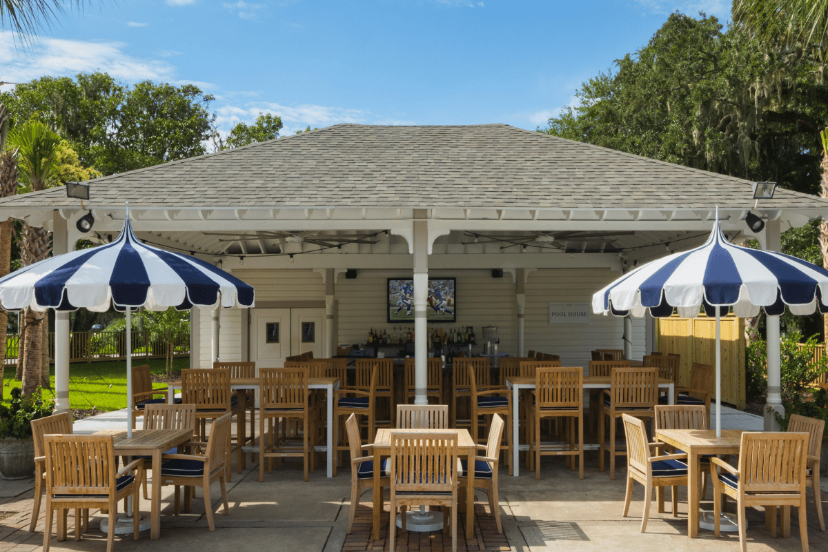 a patio with tables and chairs