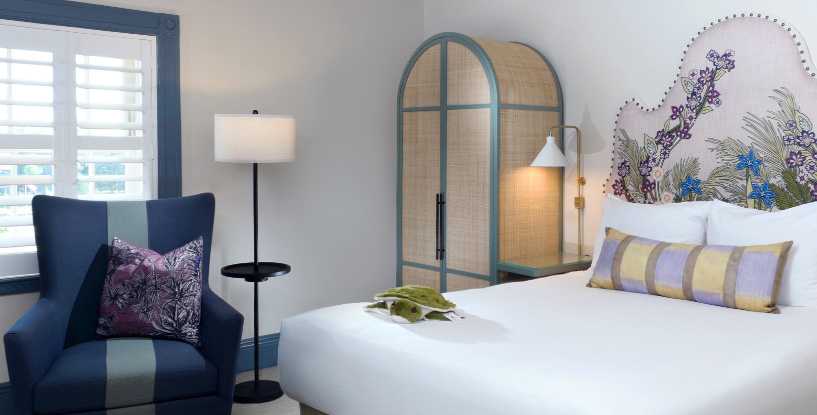 a room with a bed and a lamp