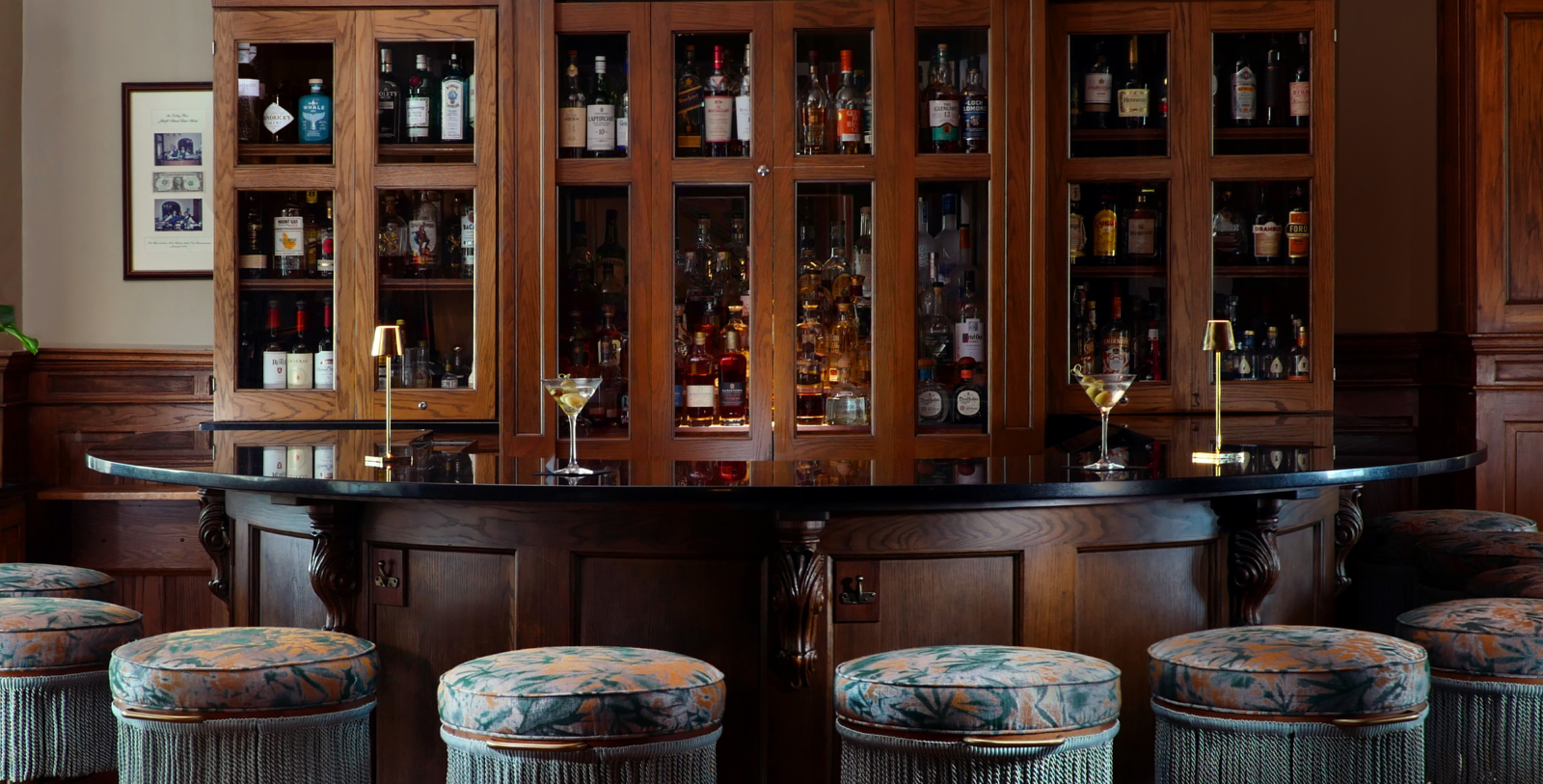 a bar with a counter and stools