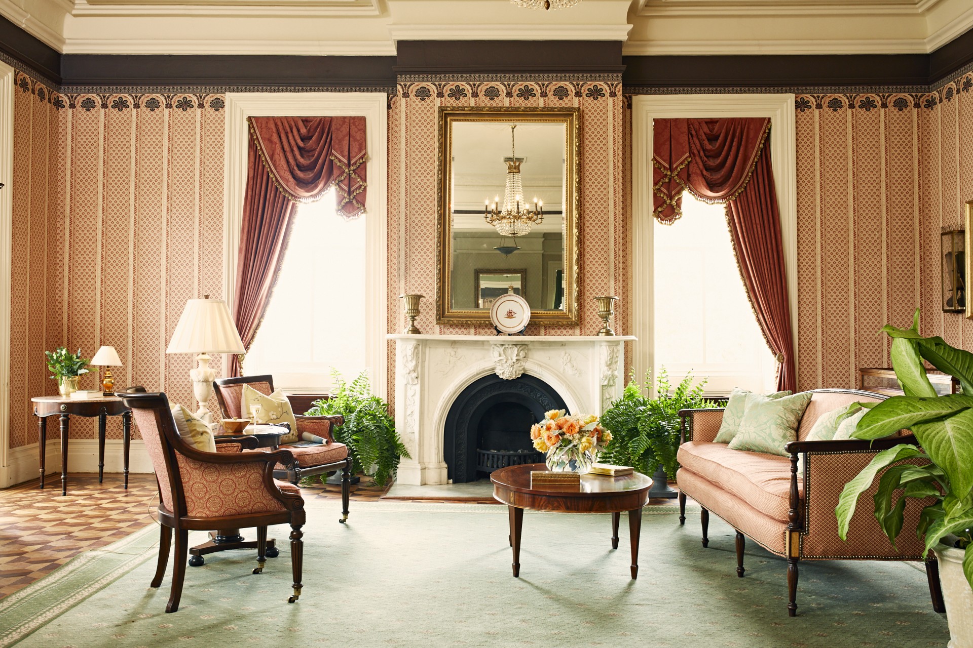 a living room with a fireplace and couches