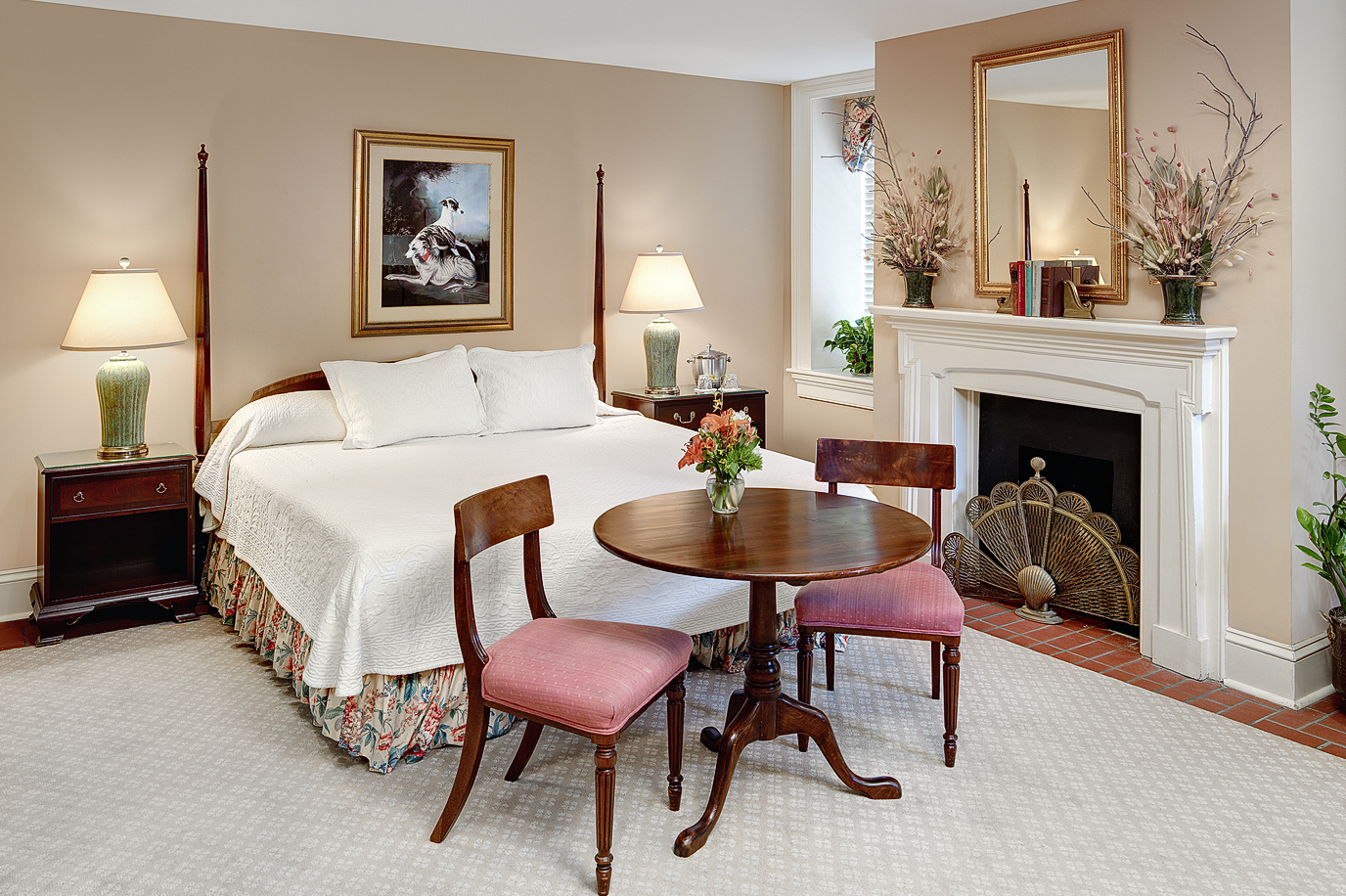 a bedroom with a bed and a table