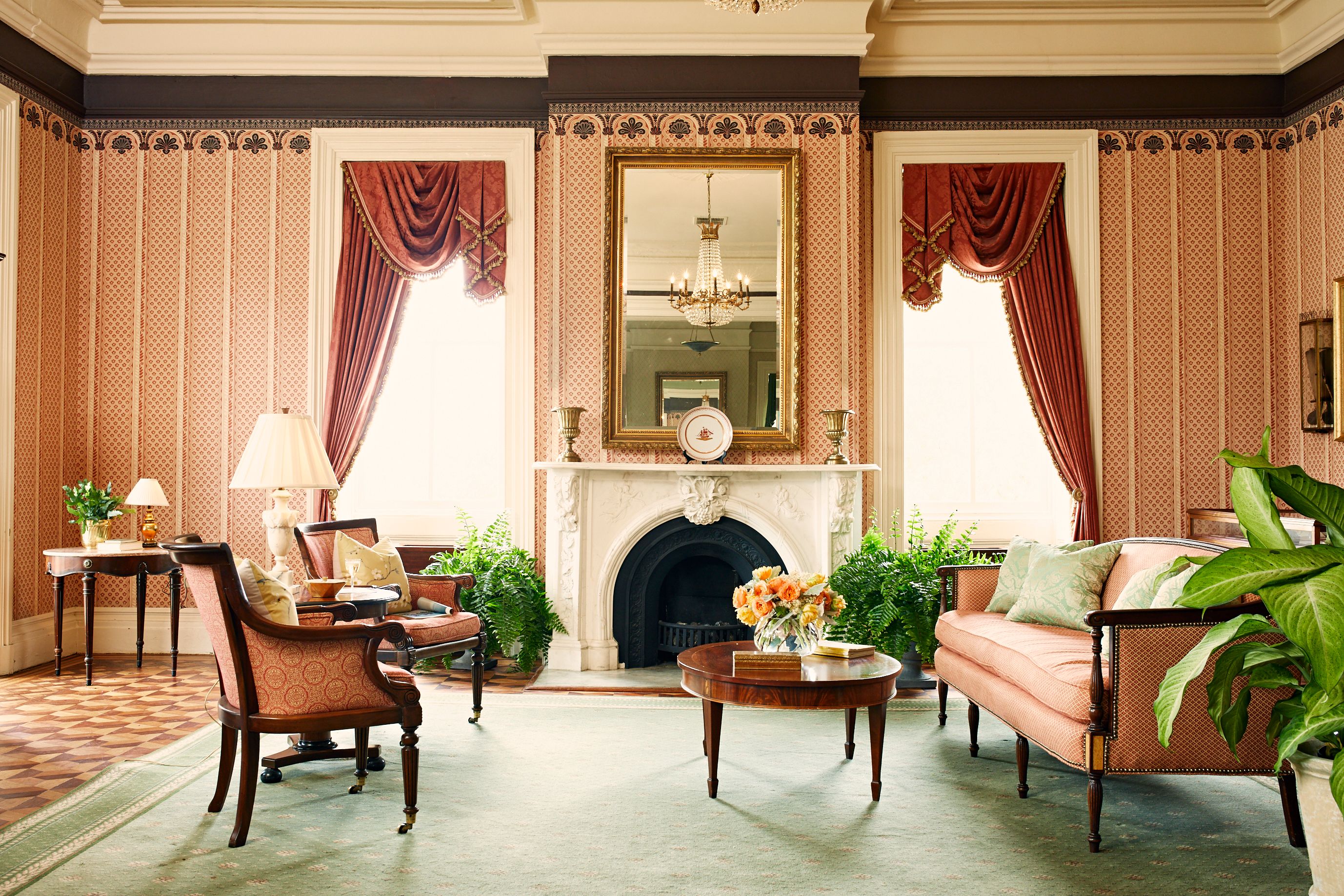 a living room with a fireplace and couches