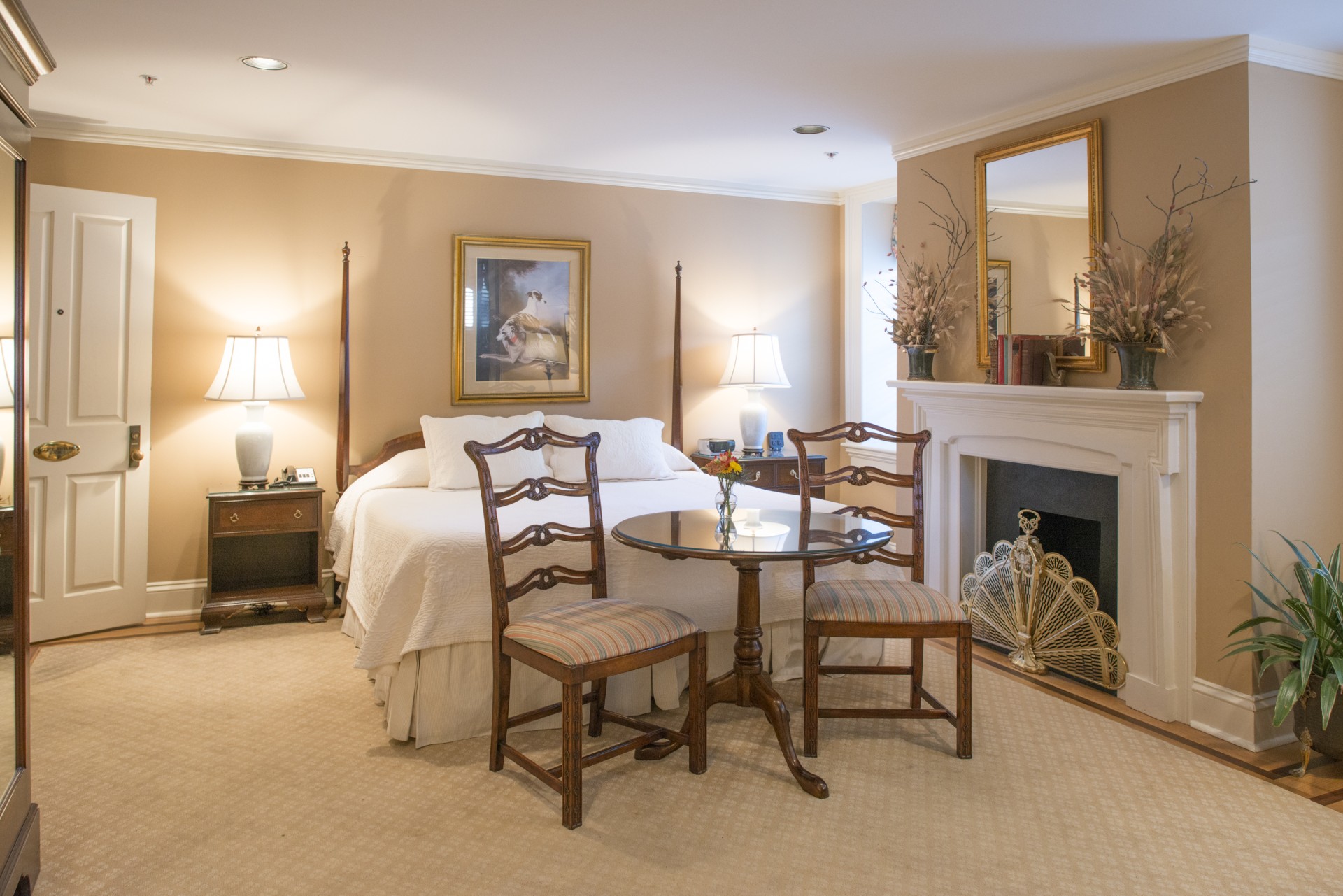a room with a bed and a fireplace