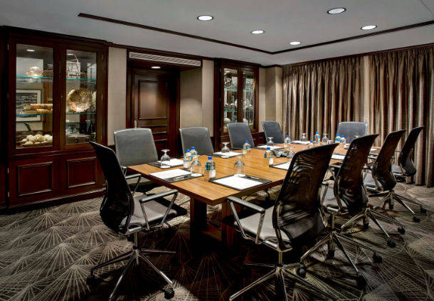 a conference room with a table and chairs