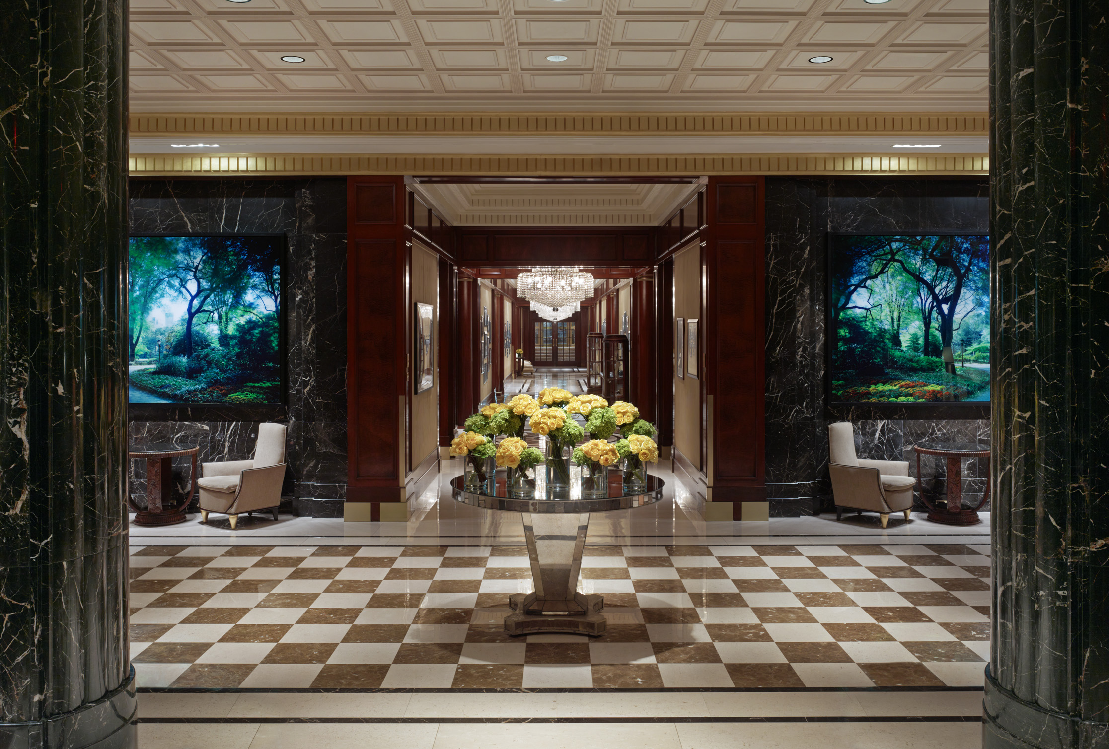 a hall with a table with flowers