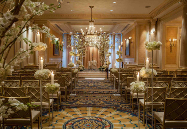 a wedding ceremony with candles and flowers