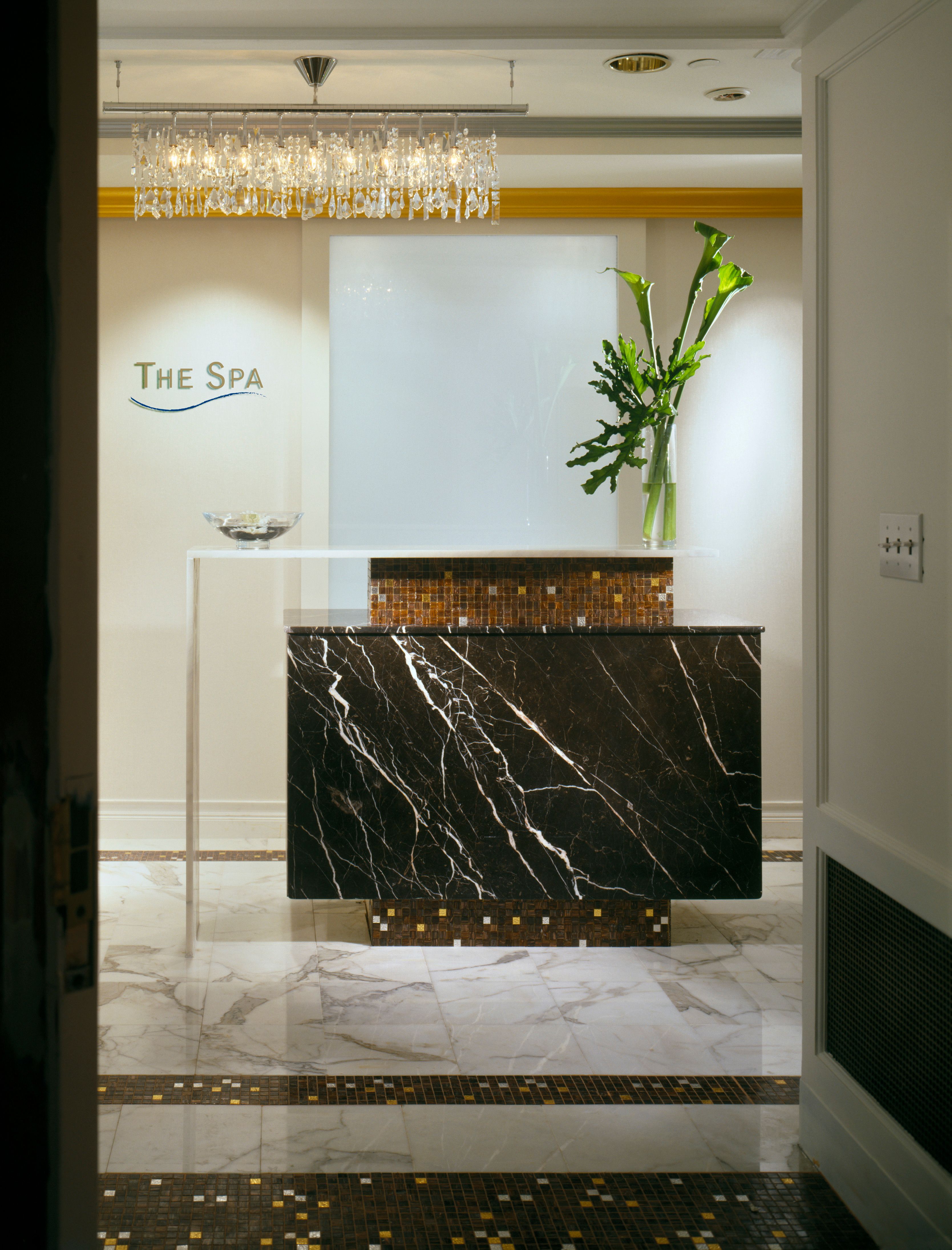 a marble counter with a glass vase on top