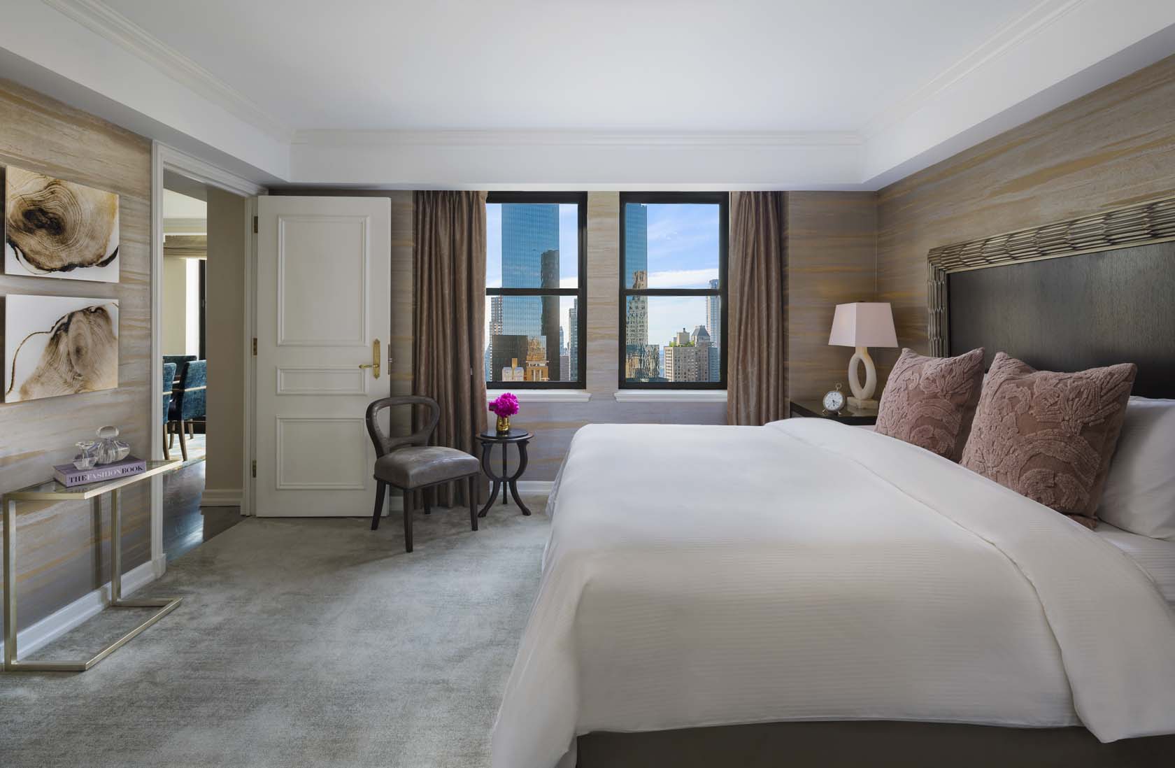 a bedroom with a large bed and a chair