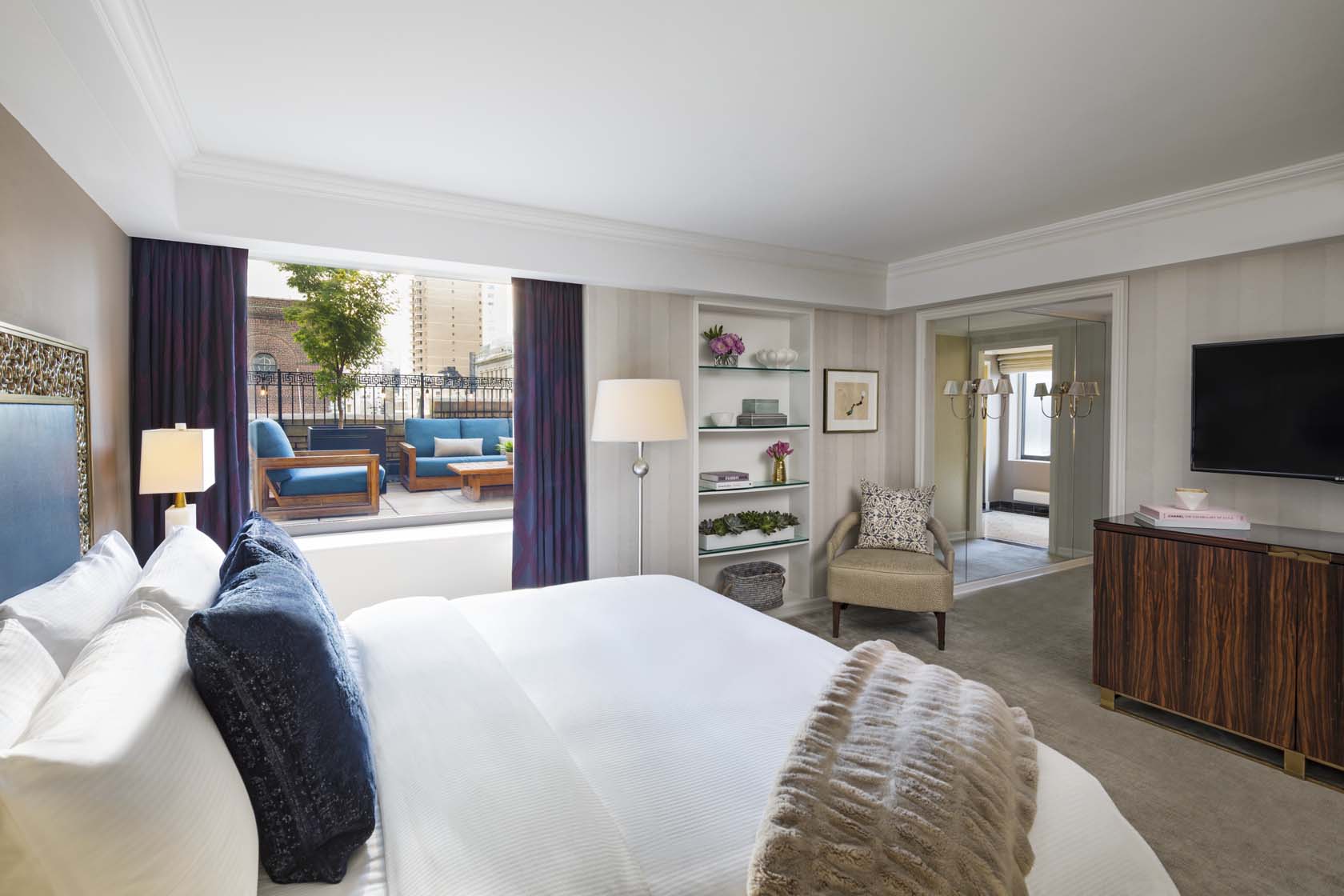 a bedroom with a bed and a chair