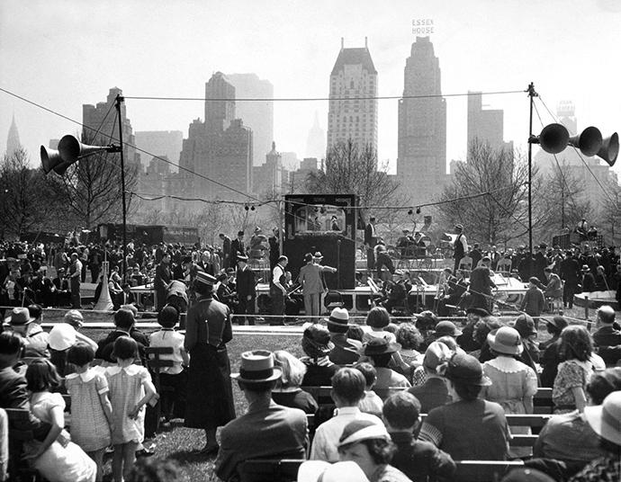 a crowd of people watching a band on stage