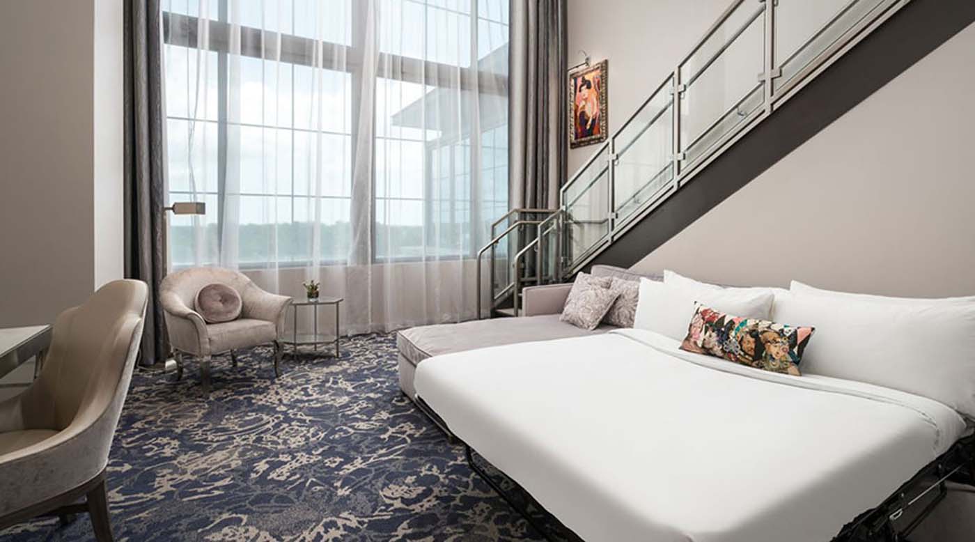 a bed and chair in a room