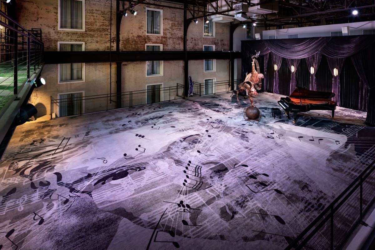 a stage with a piano and a piano on it