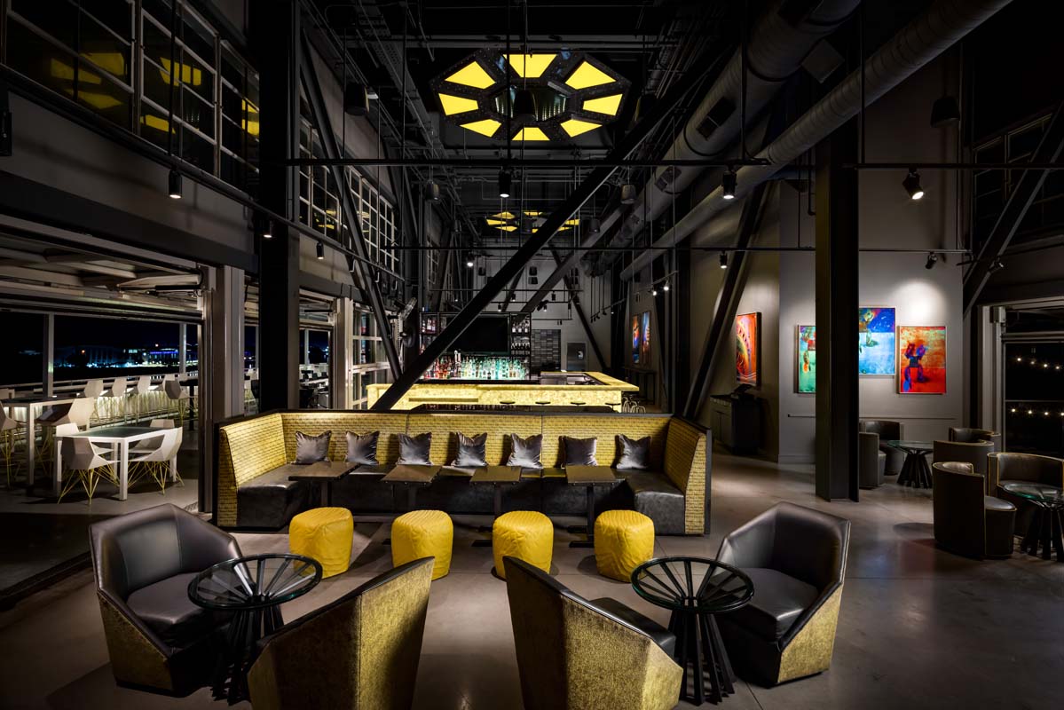 a room with yellow and black furniture