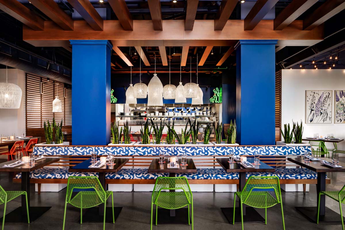 a restaurant with blue walls and tables