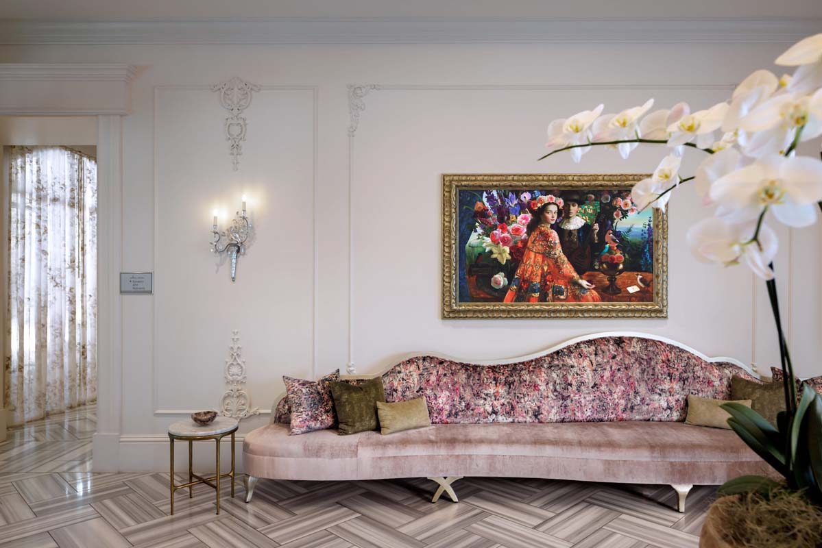 a couch in a room with a painting on the wall