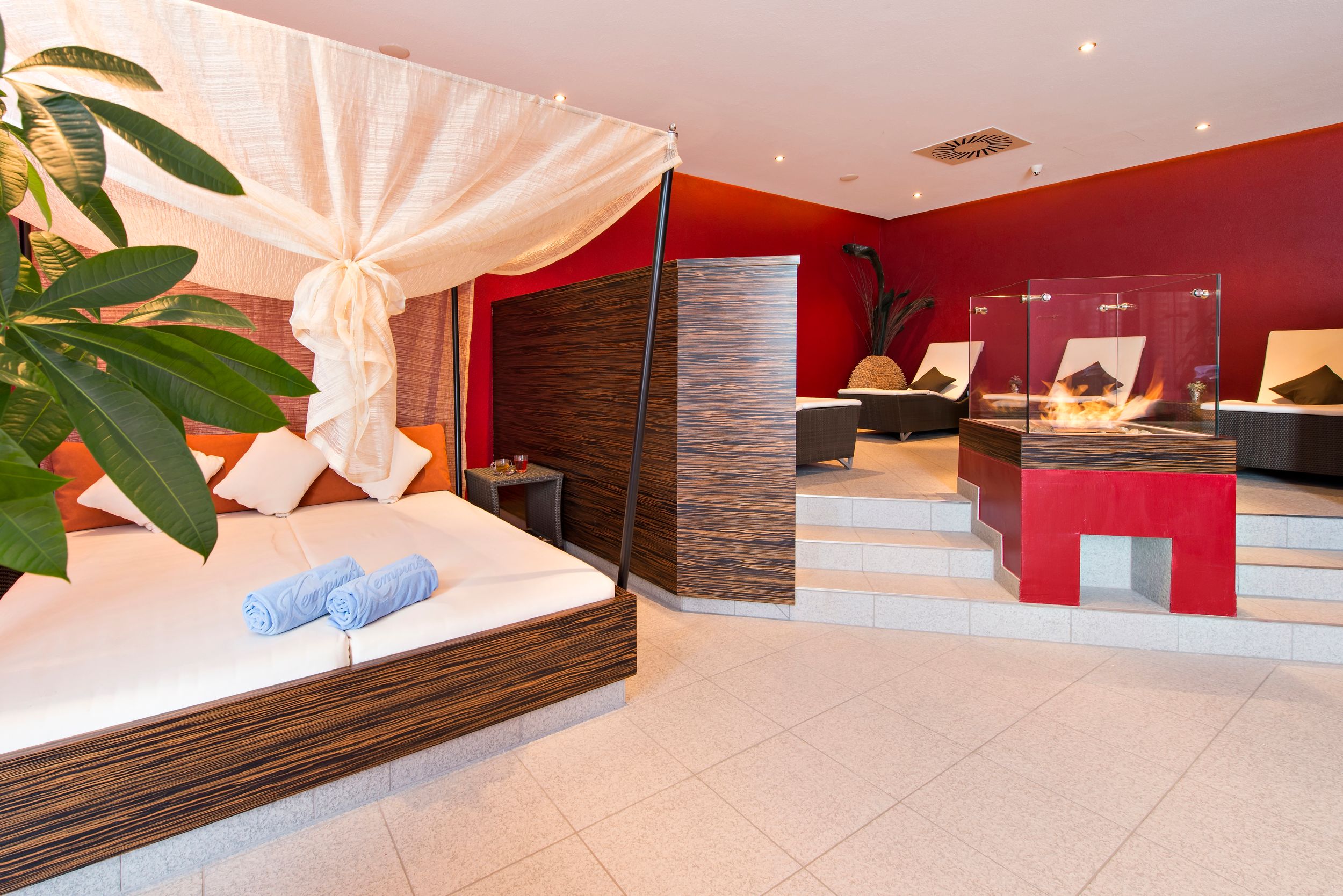 a room with a bed and a fireplace