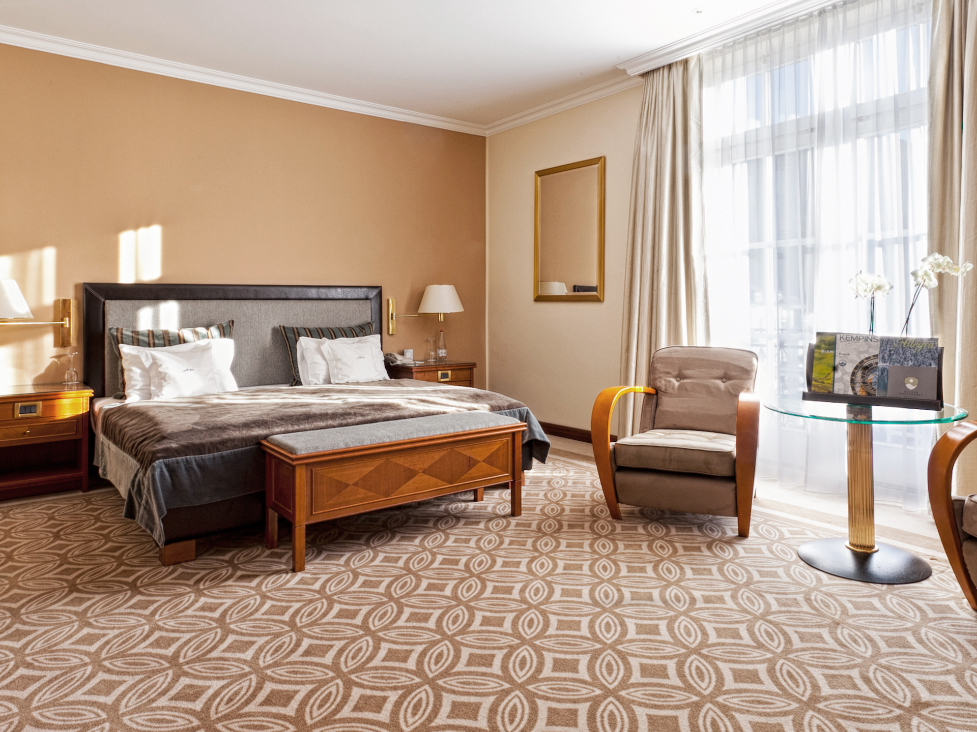 a bedroom with a bed and a chair