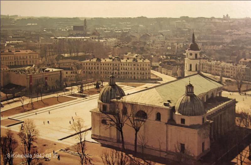 a large building with domes and a street in the background