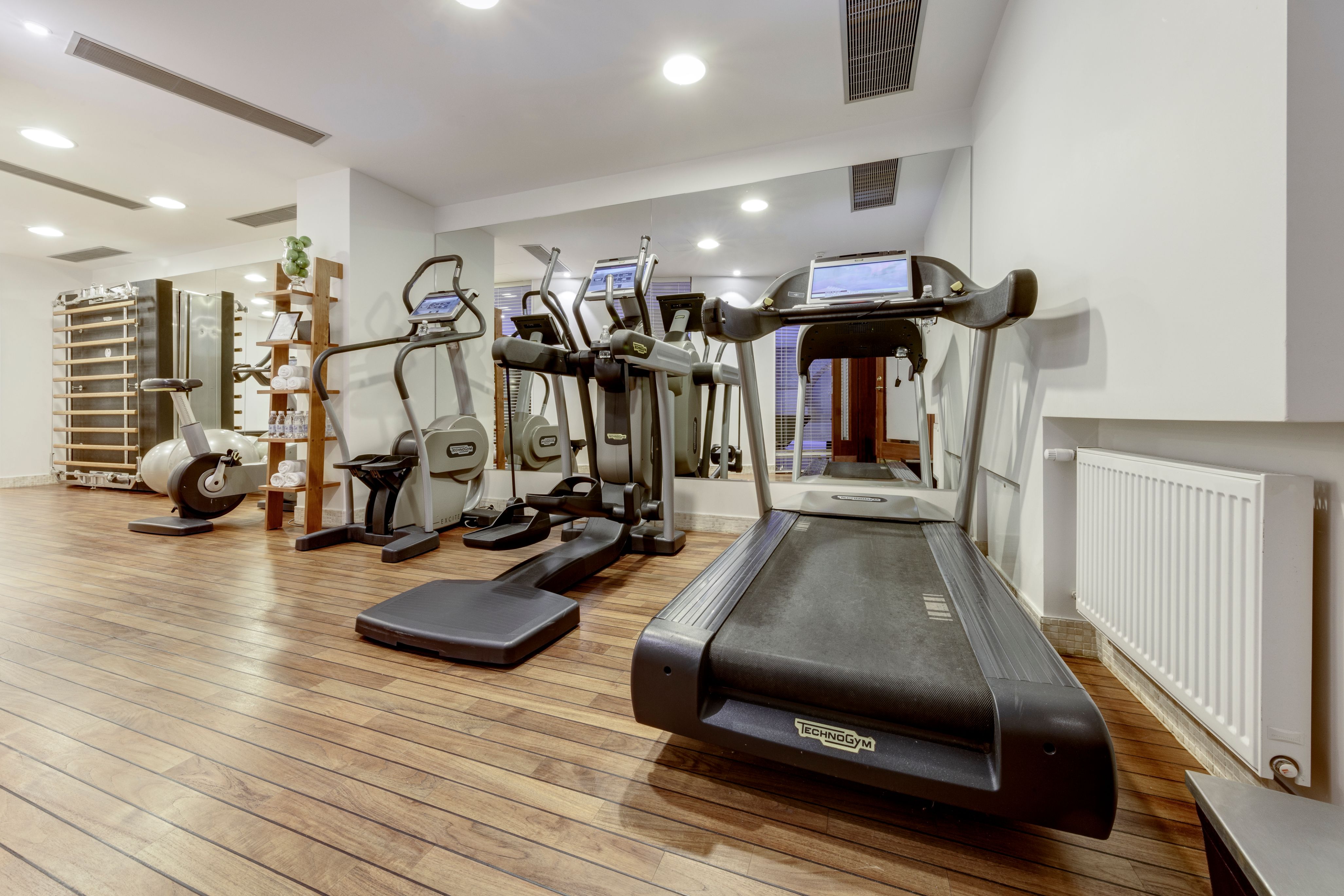 a room with treadmills and exercise equipment