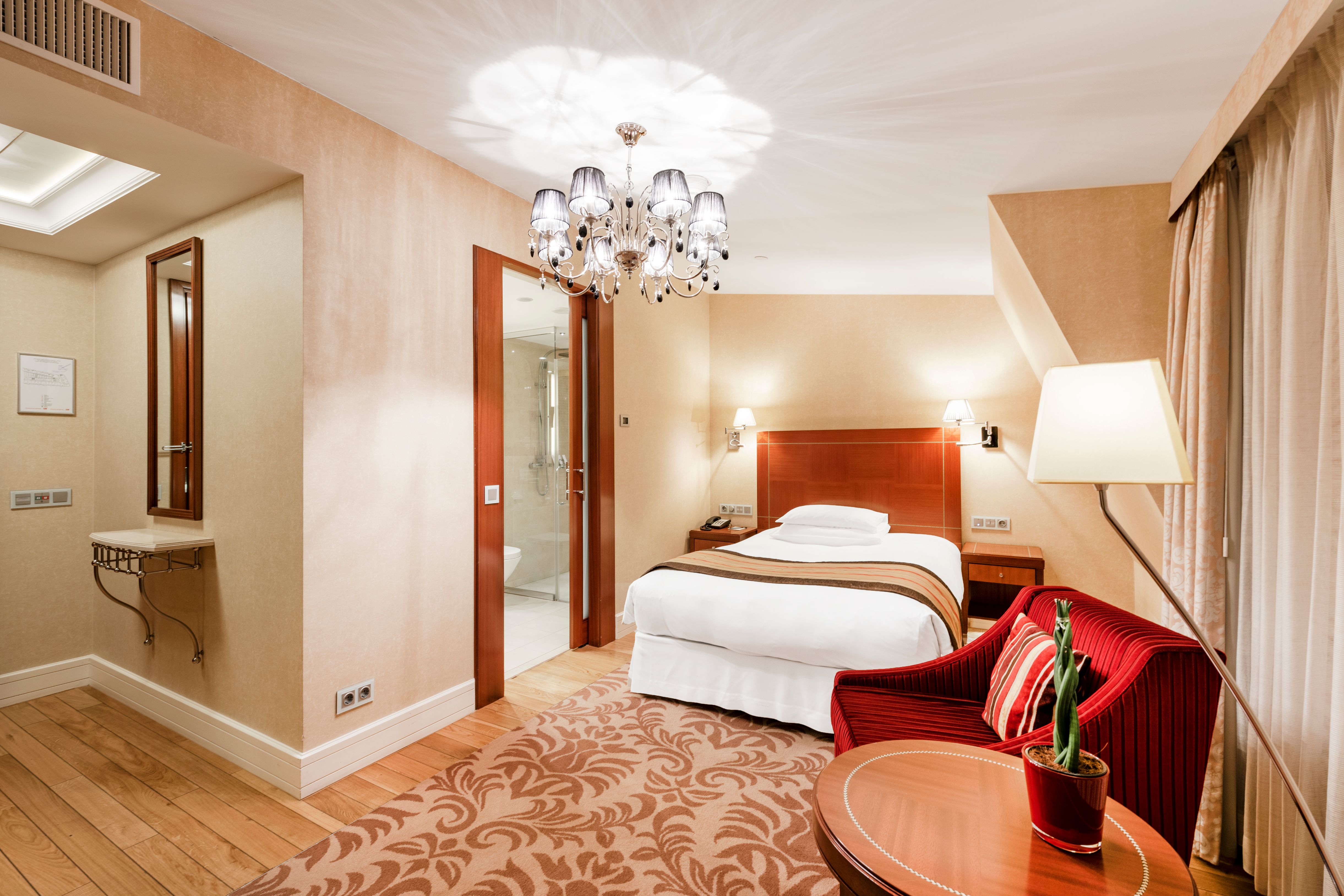 a room with a bed and a chair