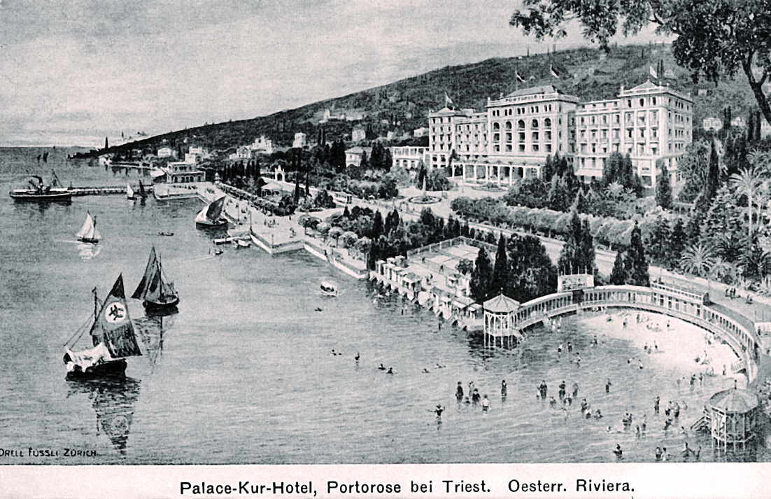 a black and white photo of a body of water with buildings and boats