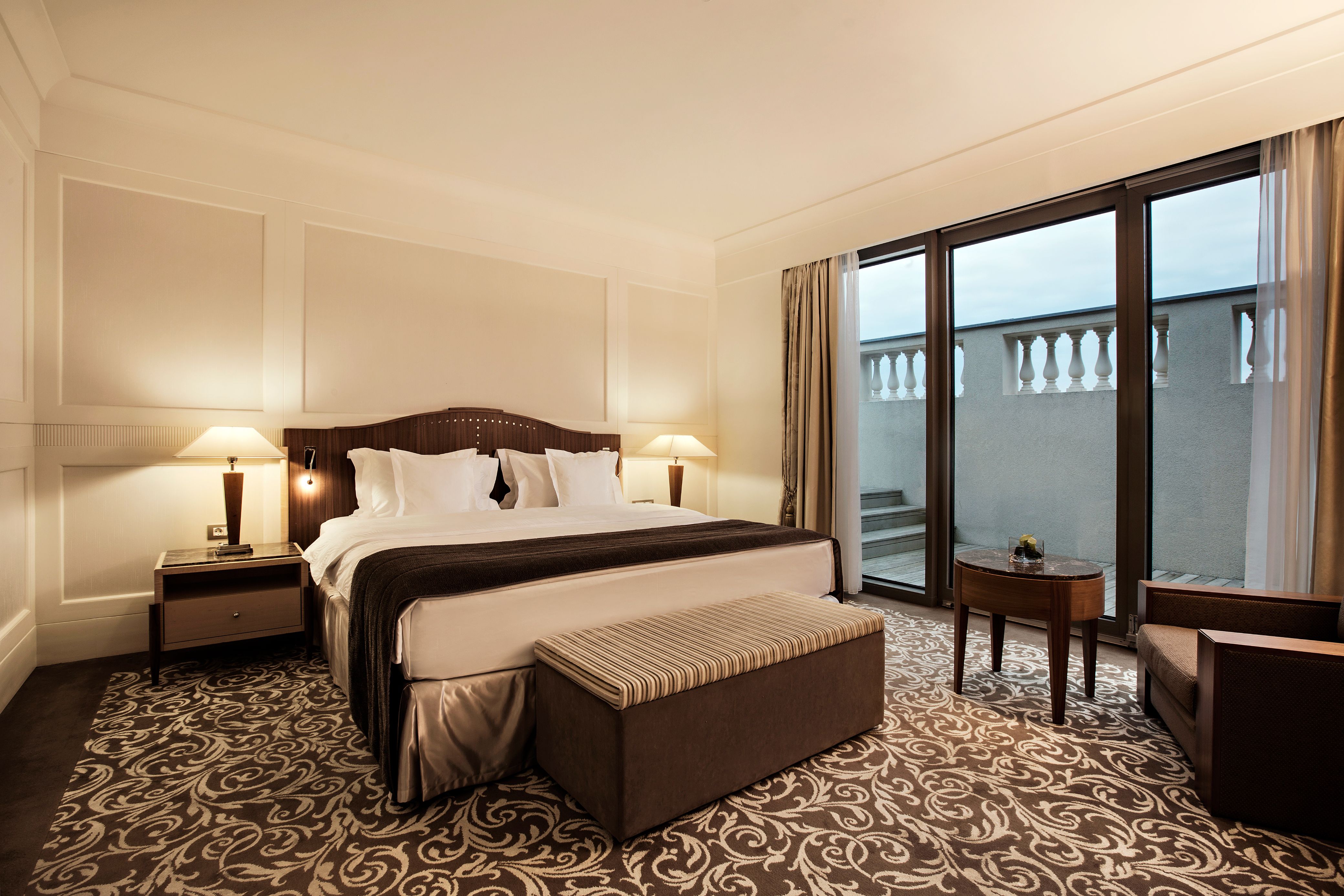 a bedroom with a bed and a table