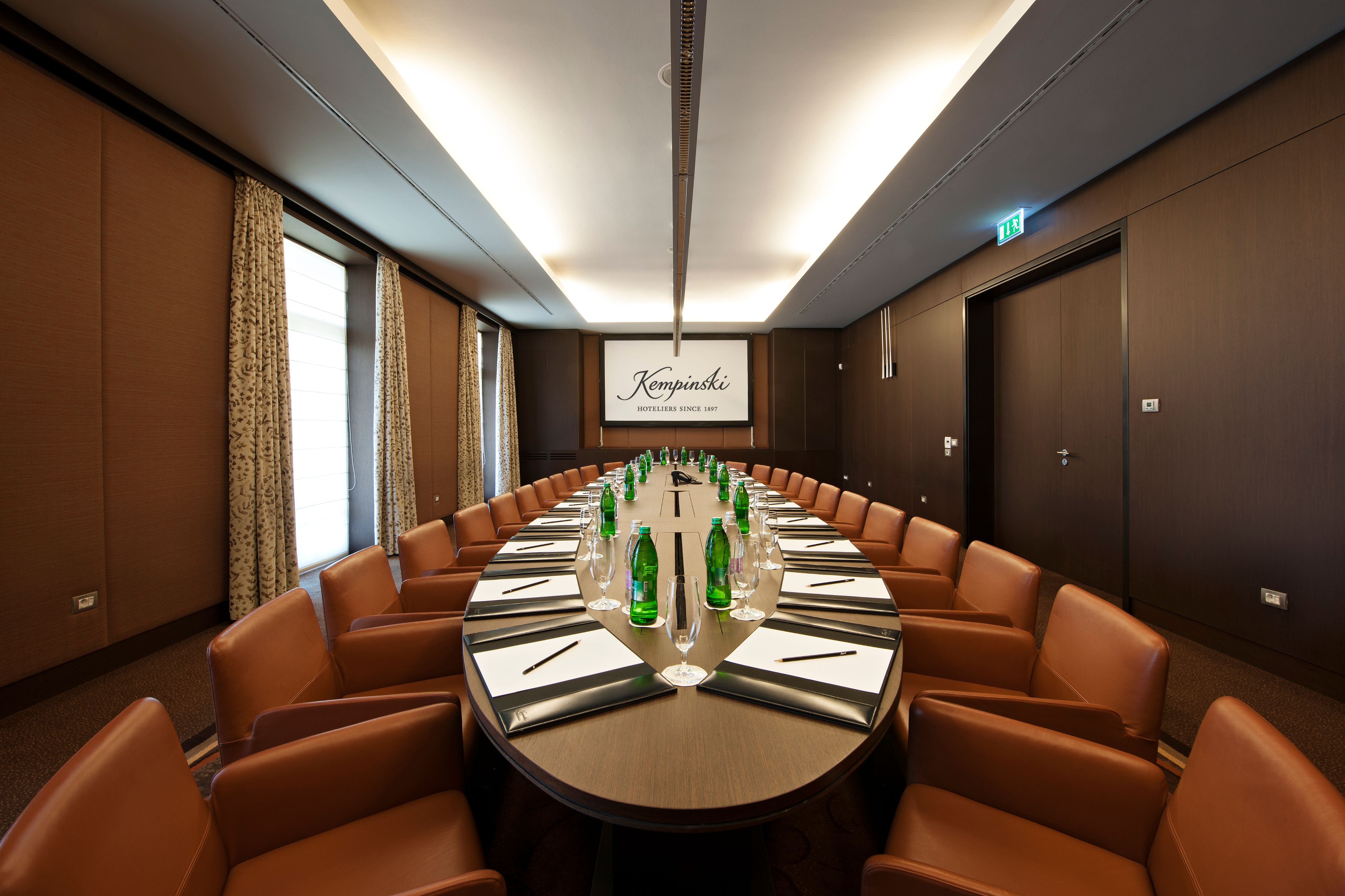 a conference room with a table and chairs