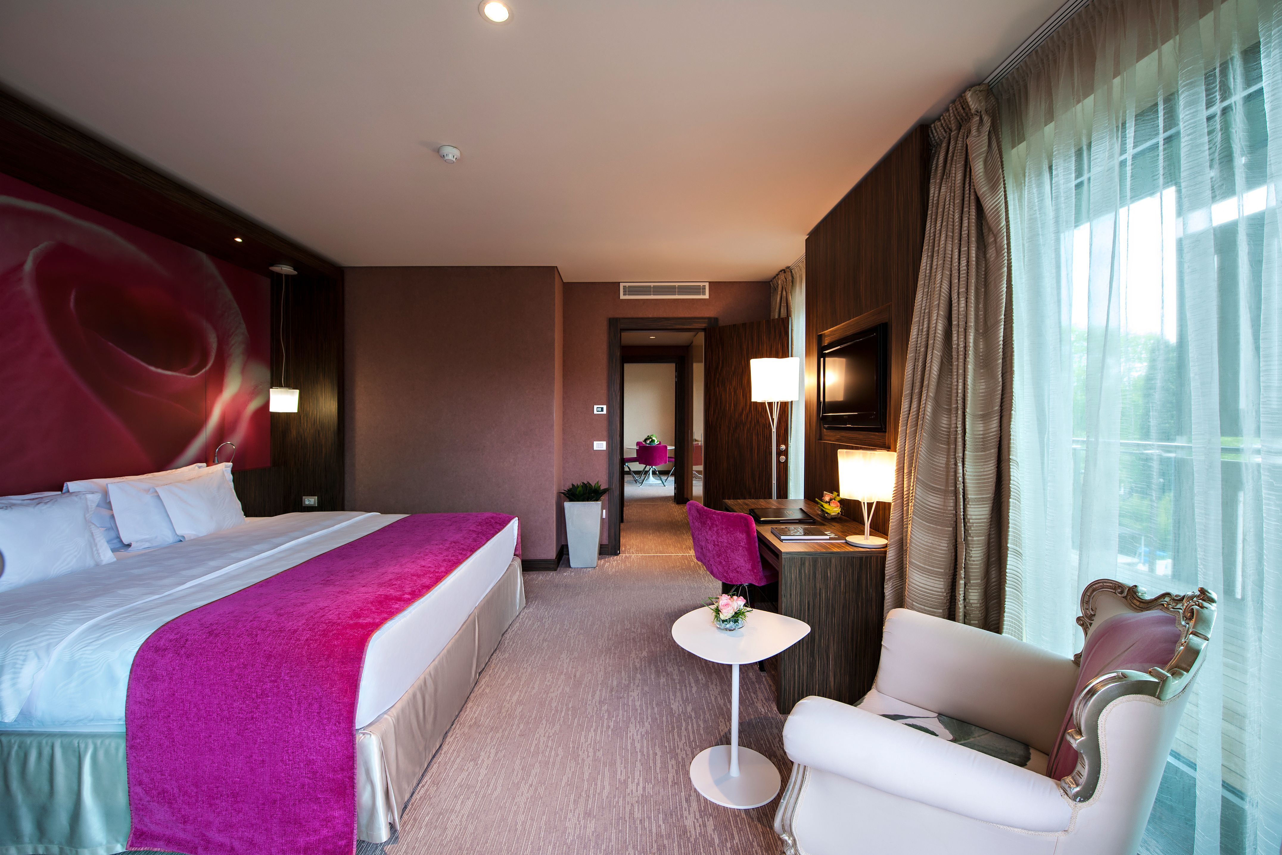 a room with a bed and a chair