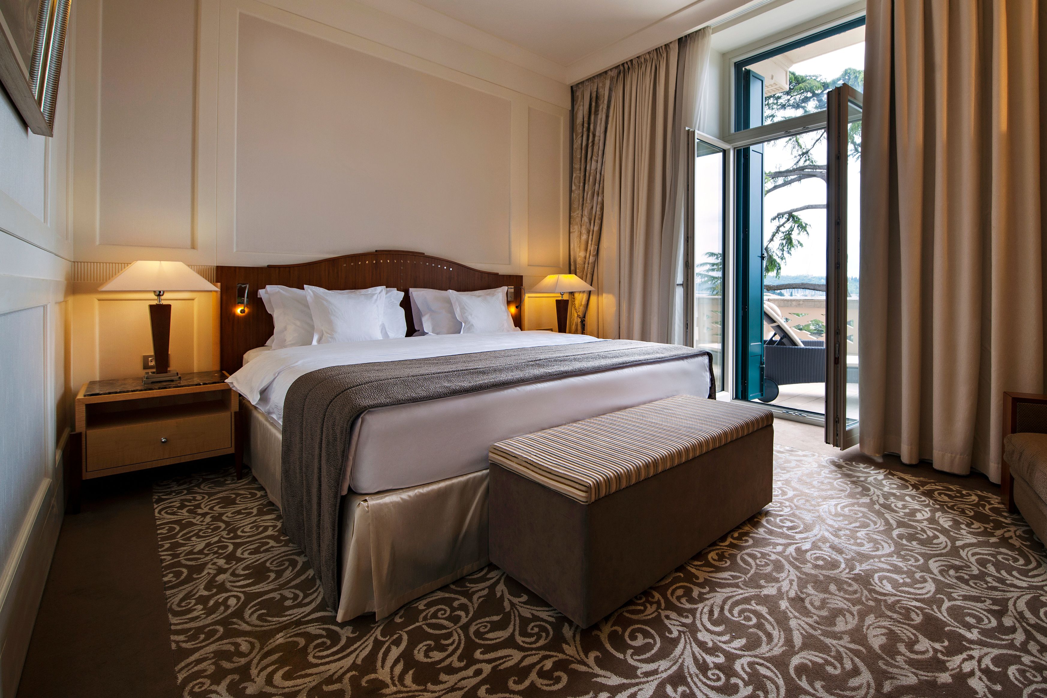 a bed with a bench and a window